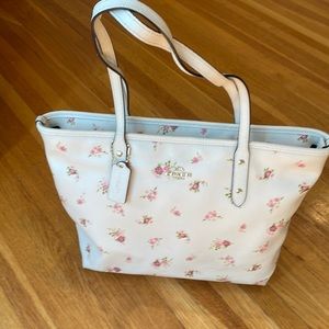 Coach cream/pink floral leather tote. Full zip top, gold hardware/trim.